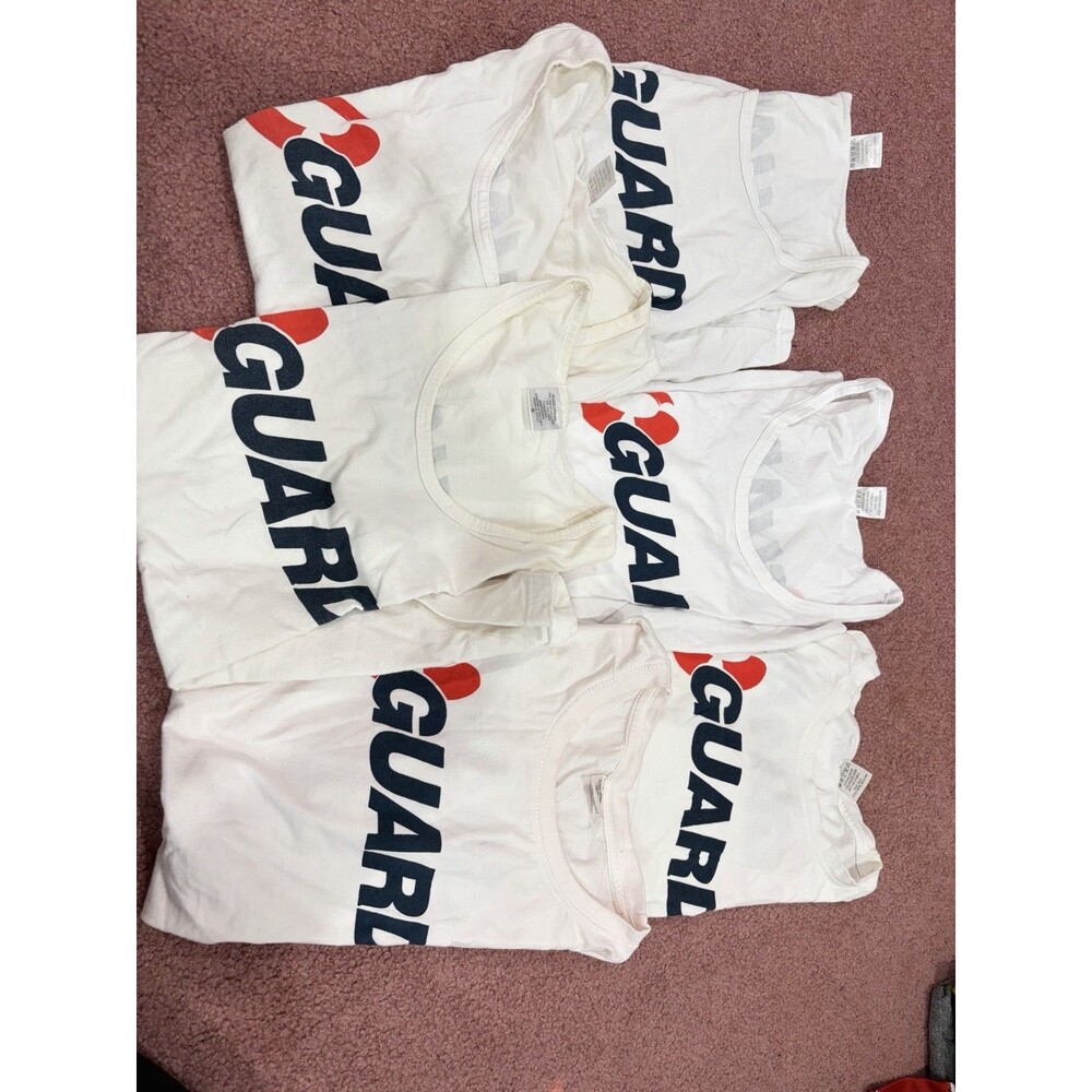 6 lifeguard shirts in good condition mix of sizes S M L